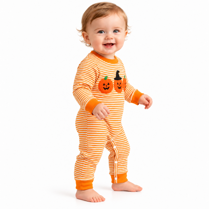 Orange Halloween jumpsuit on baby, three-quarter full-body view