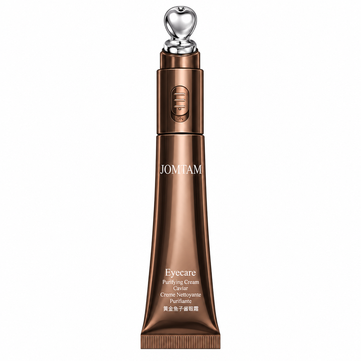 Golden Caviar eye cream applicator with metallic bronze finish and silver tip
