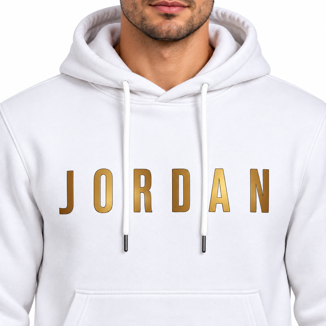 White Jordan hoodie close-up showing gold lettering, hood and drawstrings