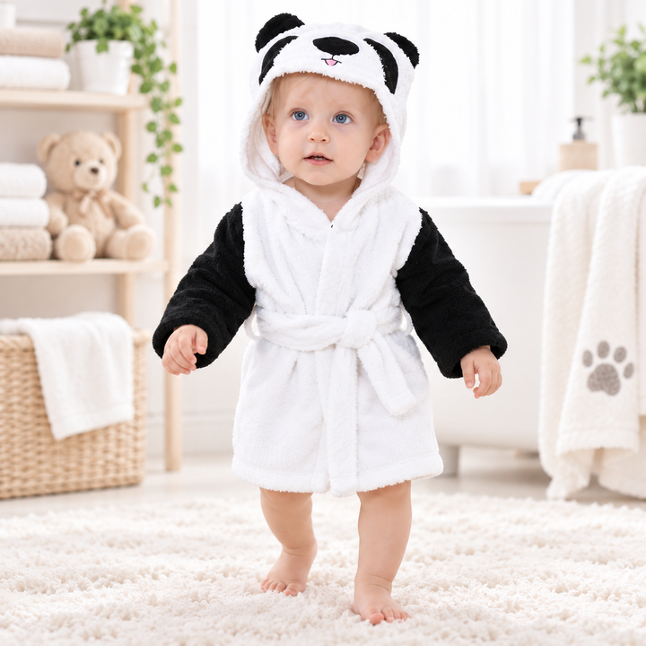 Child wearing the panda animal hooded bathrobe in a bright home setting, showing the hood, wrap front and waist belt.