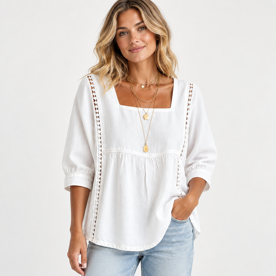 White blouse reference on a model with square neckline, gathered seam, regular sleeves and vertical lace patchwork trim.