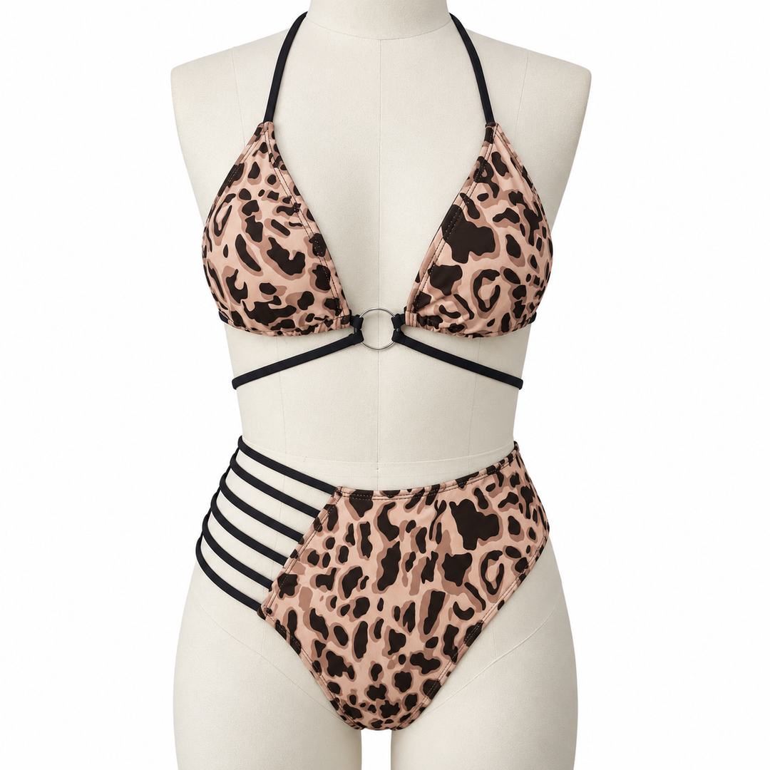 Leopard bikini on a fabric display mannequin against white, showing the halter neckline, center ring and black strap details.