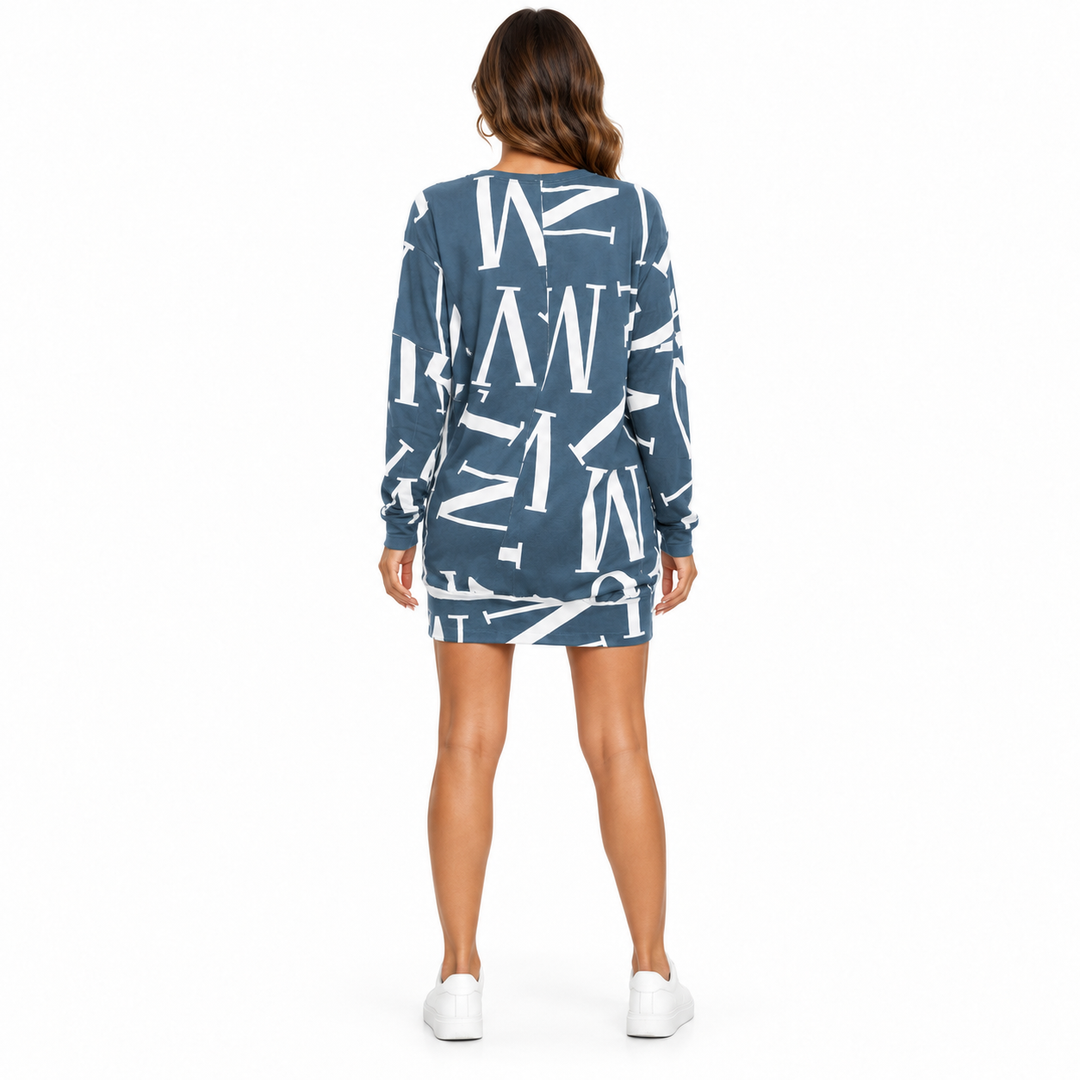 Back view of the blue letter design dress with long sleeves and a clean white studio background.