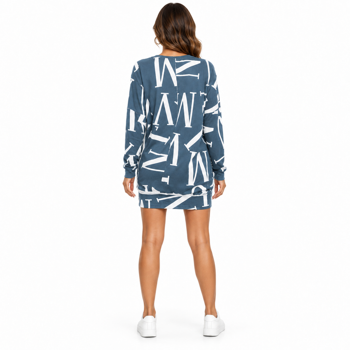 Back view of the blue letter design dress with long sleeves and a clean white studio background.
