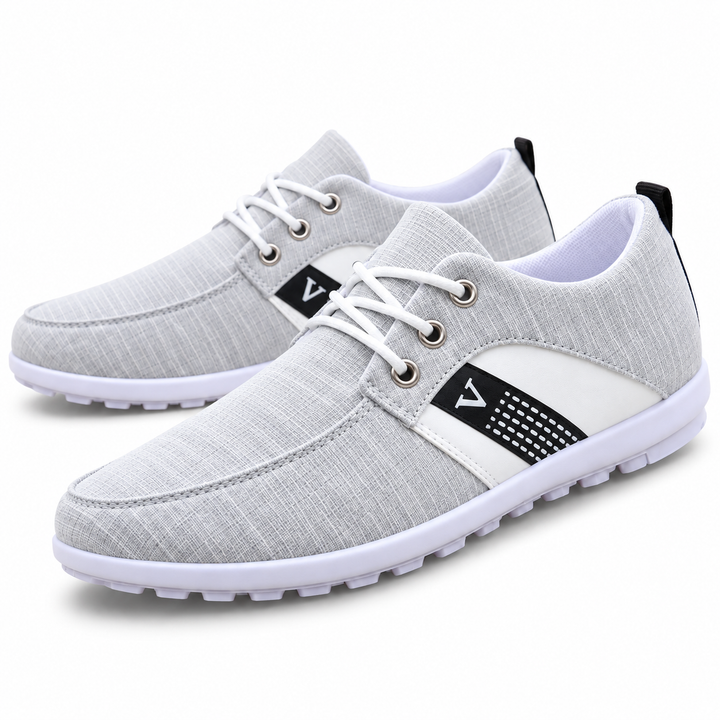 Light gray lace-up shoe on white background with side detail and white outsole
