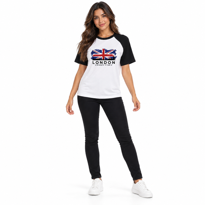 Full-body view of the printed tee worn untucked with black trousers