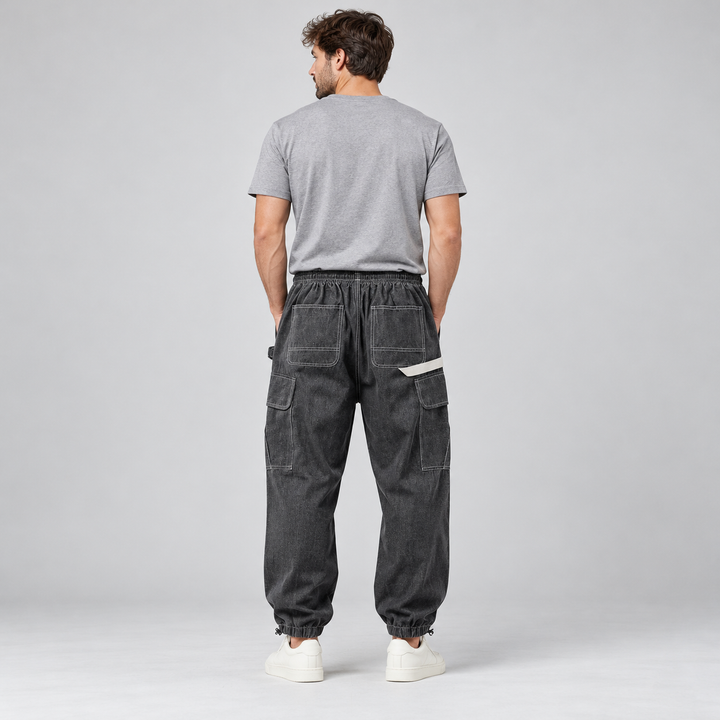 Back view of black cargo joggers with rear patch pockets on a full-body male model.