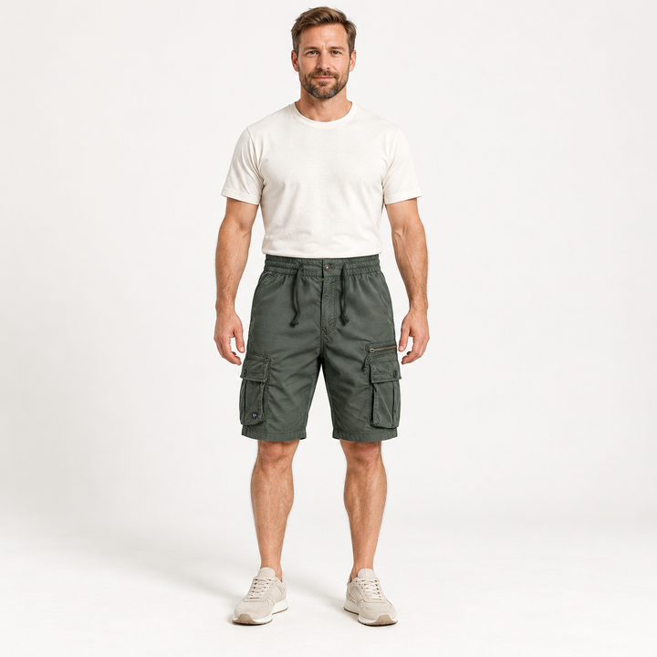 Front view of army green cargo shorts with a drawstring waist on a full-body model.