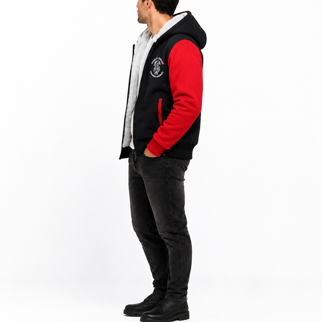Red and black hooded fleece jacket seen from the side on a male model to display full profile, sleeve length, and hood shape.