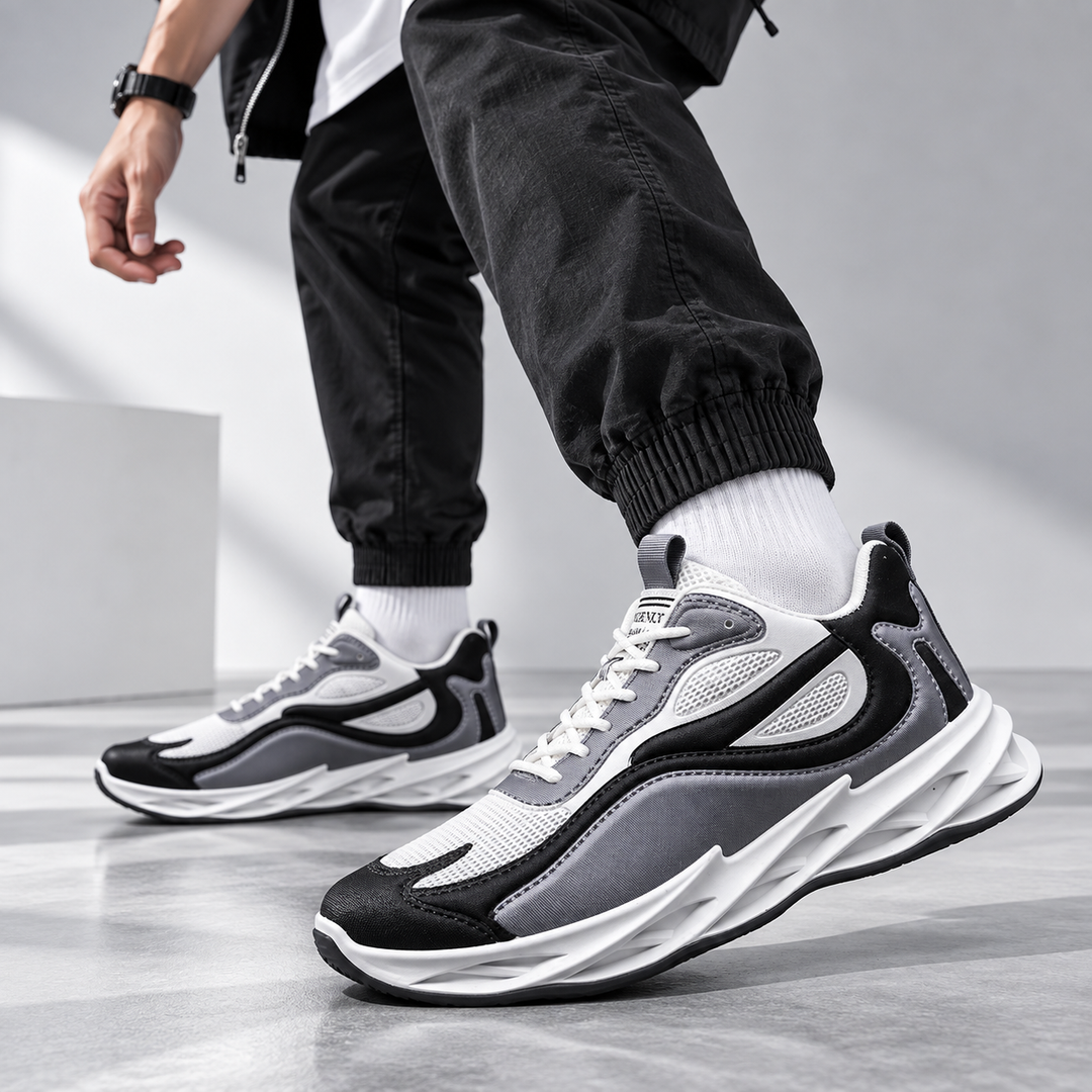 Men wearing gray mesh running sneakers in a walking pose