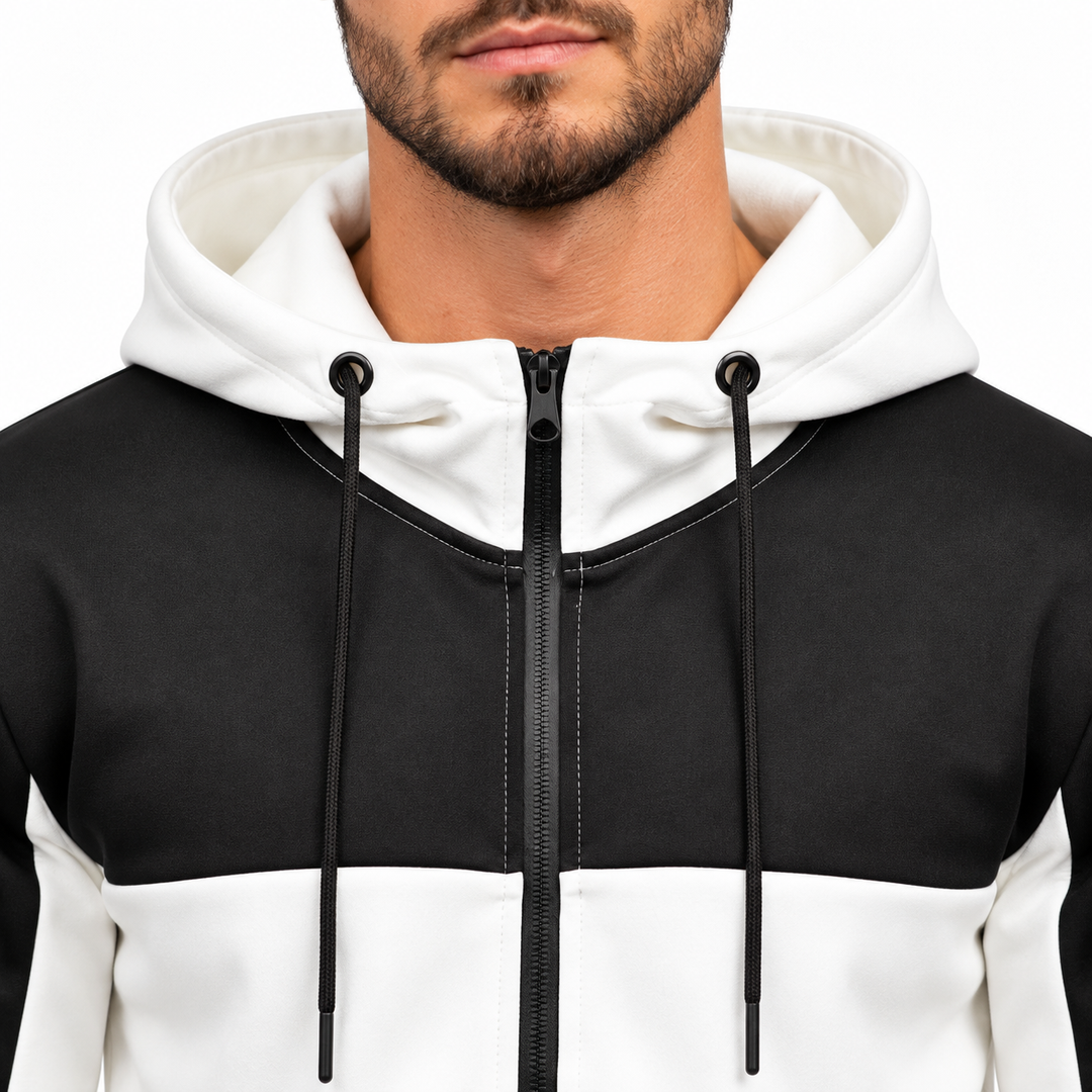 Close-up of white hood, black chest panel, zipper and drawstrings