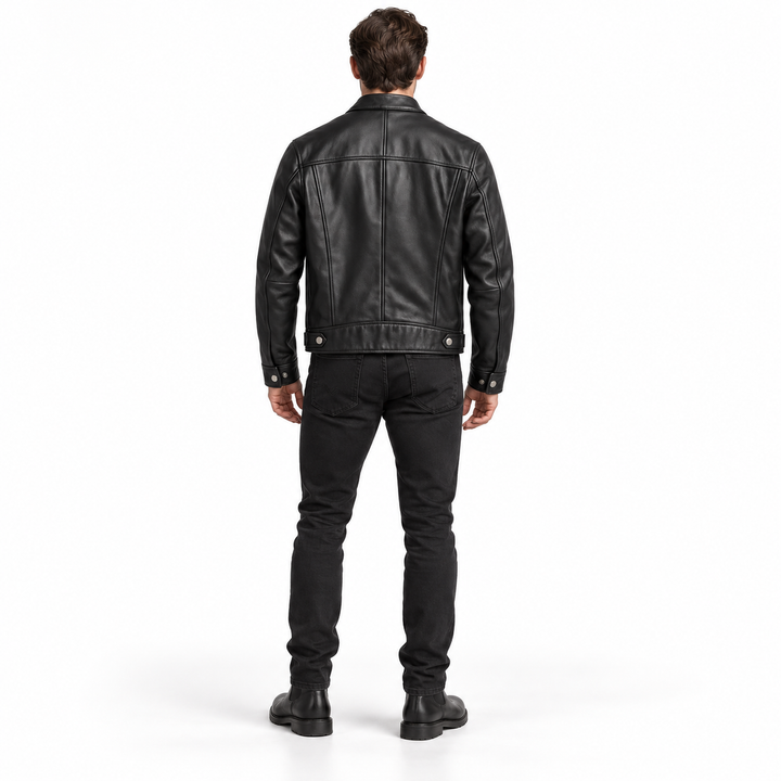 Black jacket rear view showing back seams, hem tabs and cuff snaps on a full-body model.