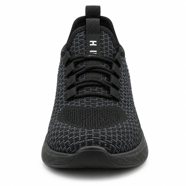 Front view of Black Style 1 knit work shoe showing the toe, black laces and knit tongue.
