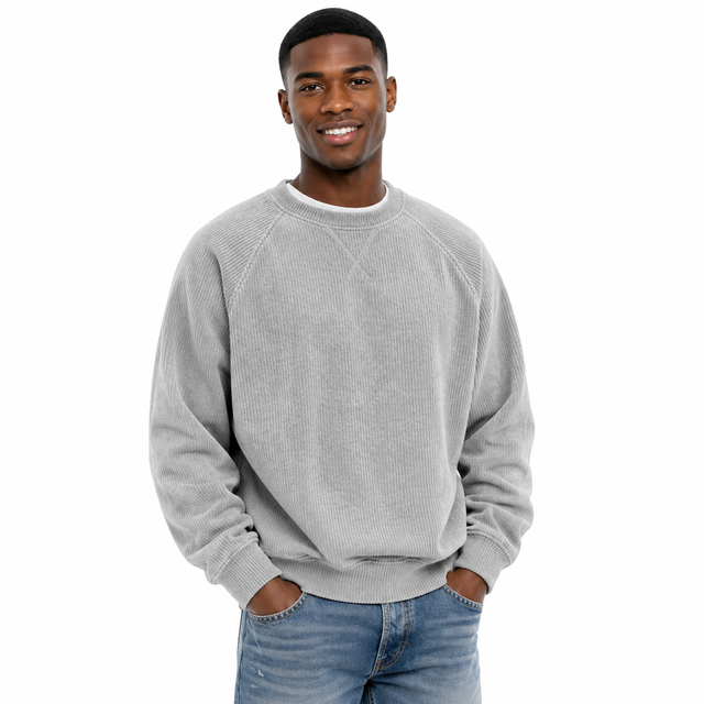 Men's loose fit sweatshirt in light gray with ribbed knit texture, long sleeves and relaxed shape on a male model.
