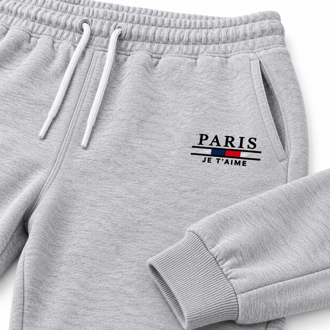 Close-up of grey Paris sweatpants showing waistband, drawstring, pocket, stitching and cuff detail