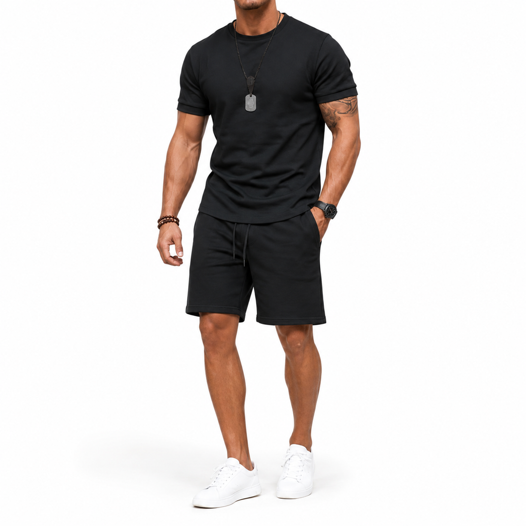 Men's plus-size casual two-piece set in black, shown full length on a male model against a clean white studio background.