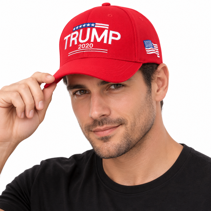 Male model wearing a red Trump 2020 embroidered baseball cap with a US flag side patch.
