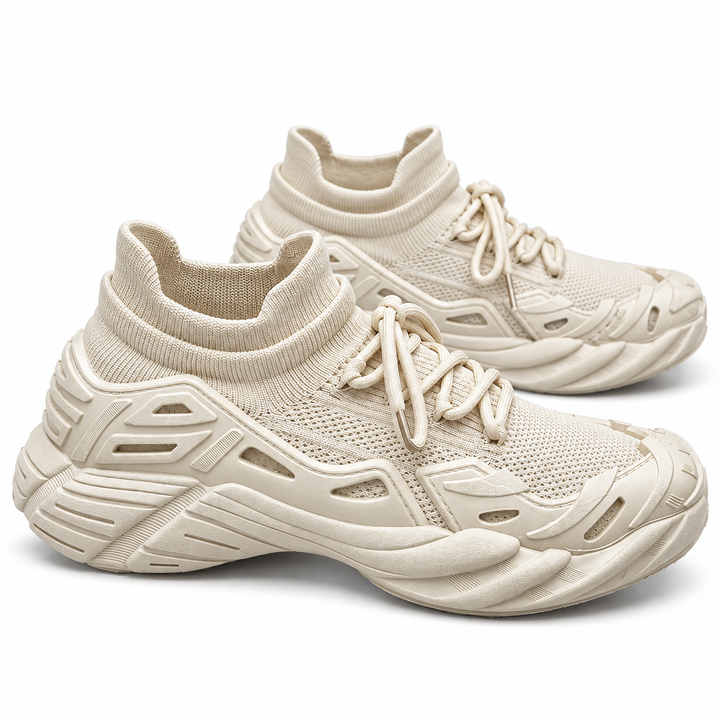 Beige fly-knit running shoes shown as a pair on a white background