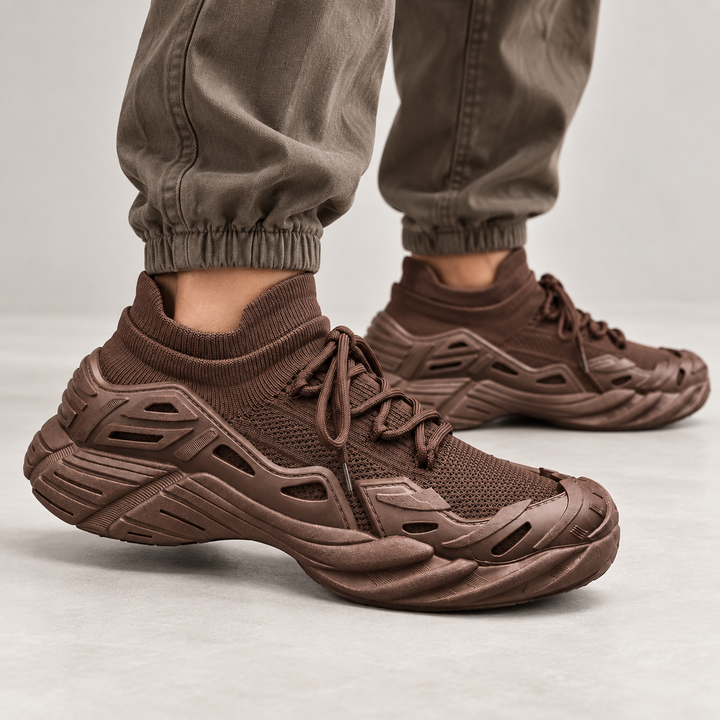 Coffee color running shoes shown on foot in a studio movement view