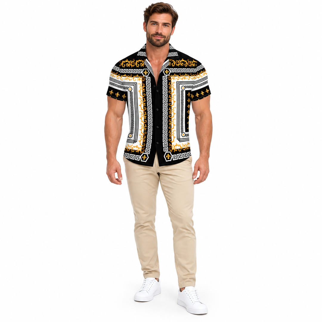 Male model shown wearing the black white and gold baroque collared shirt in beige trousers and white shoes in a white studio.