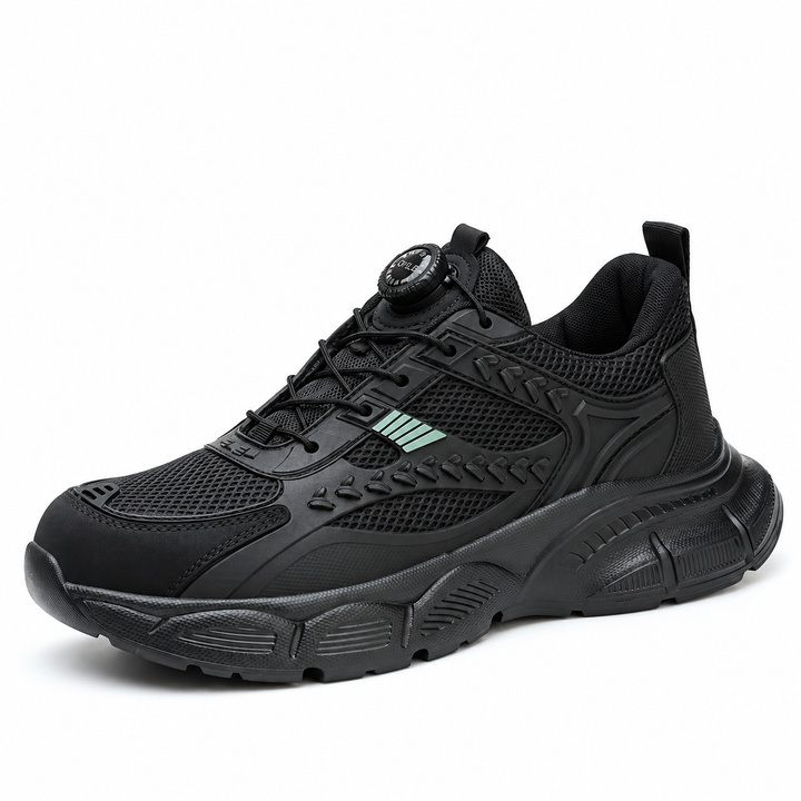Black model 9233 shoe in a reference-based three-quarter view showing mesh panels, green accents and sculpted sole in studio.