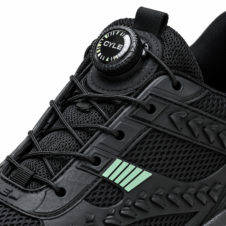 Close-up of black shoe front rotary fastening and cable arrangement showing the original dial and mesh surface in the studio.