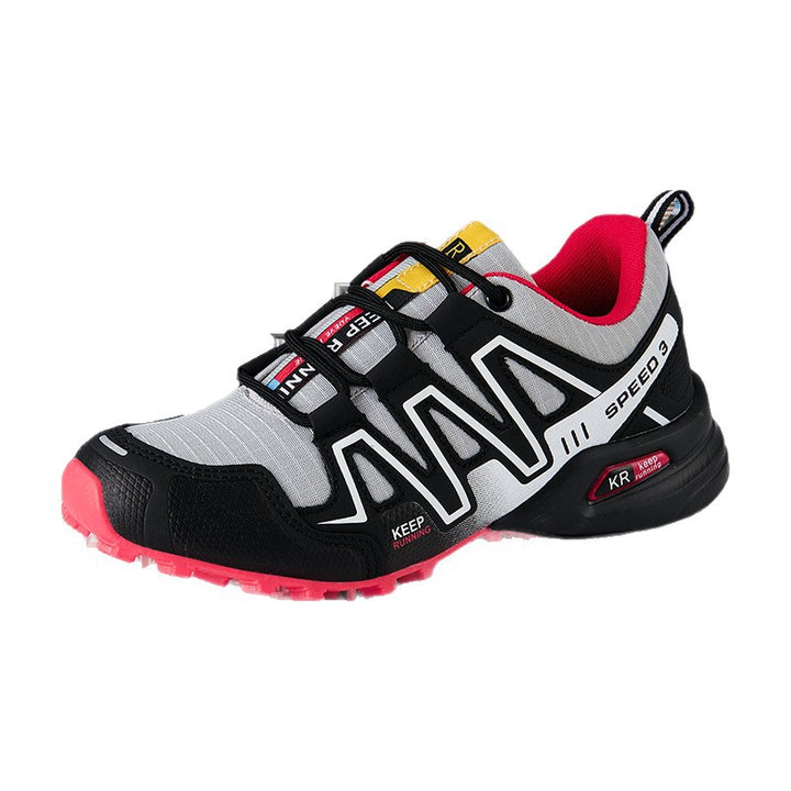Gray trail running shoe variant with black overlays and red outsole