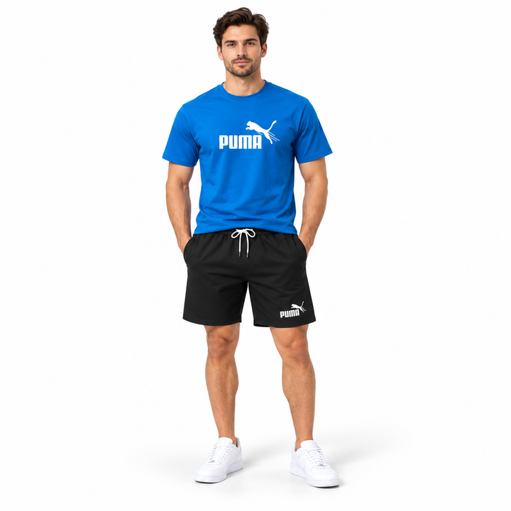 Male model wearing blue T-shirt and black shorts 2-piece set front view