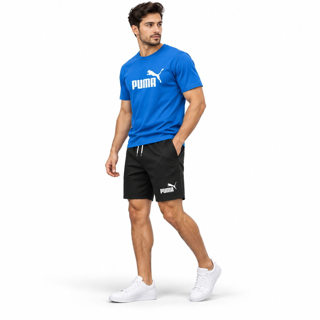 Male model wearing blue T-shirt and black shorts 2-piece set 3/4 view