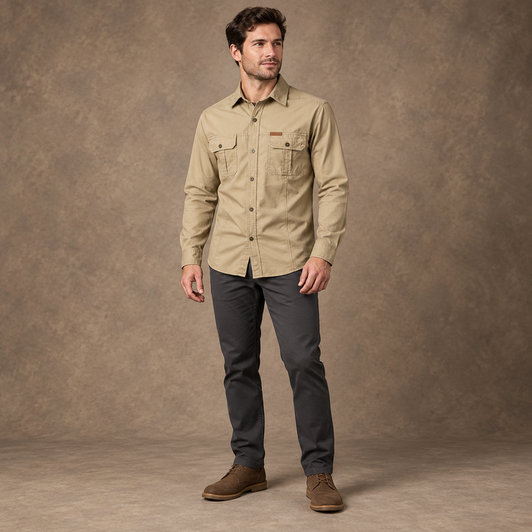 Full-body model wearing a khaki long-sleeve utility shirt with two buttoned chest pockets.