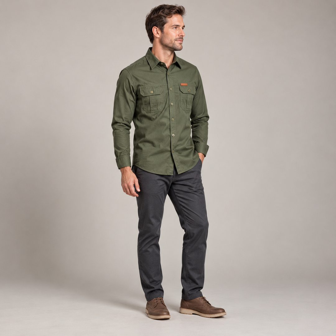 Three-quarter view of an army green utility shirt with a pointed collar and chest pockets.