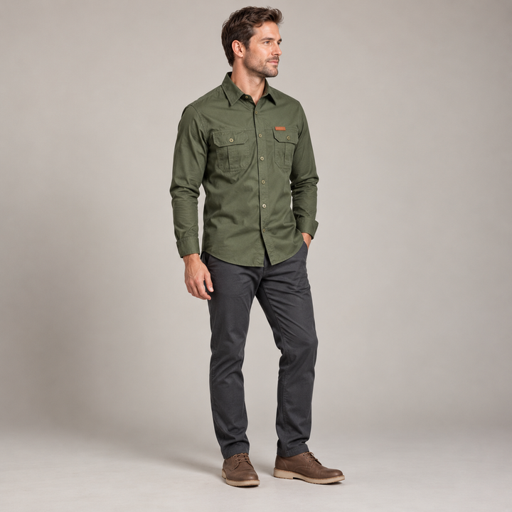 Three-quarter view of an army green utility shirt with a pointed collar and chest pockets.