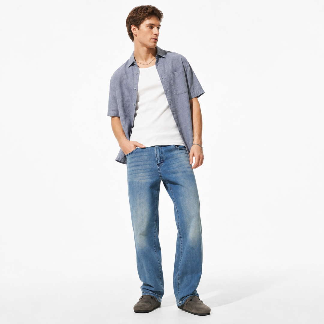 Men's washed wide-leg jeans in a polished full-length studio hero view with Baoli Blue wash, relaxed legs and faded details.