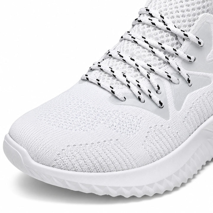 White mesh running shoe close-up showing mesh fabric, flecked laces and textured sole