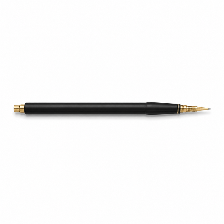 Black calligraphy pen side view with gold tip on white background