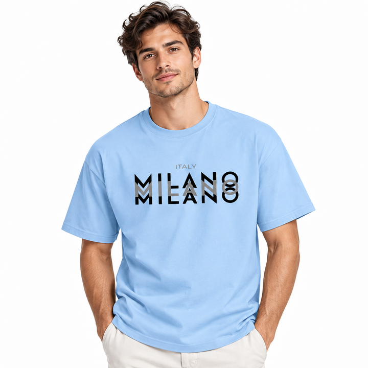 Male model wearing the light blue Milano cotton T-shirt on a white studio background.