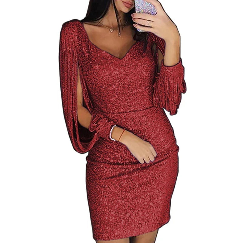 Red V-neck mini dress in a white background cutout showing a slim fit, tassel sleeves and shimmering fabric for outfit ideas.