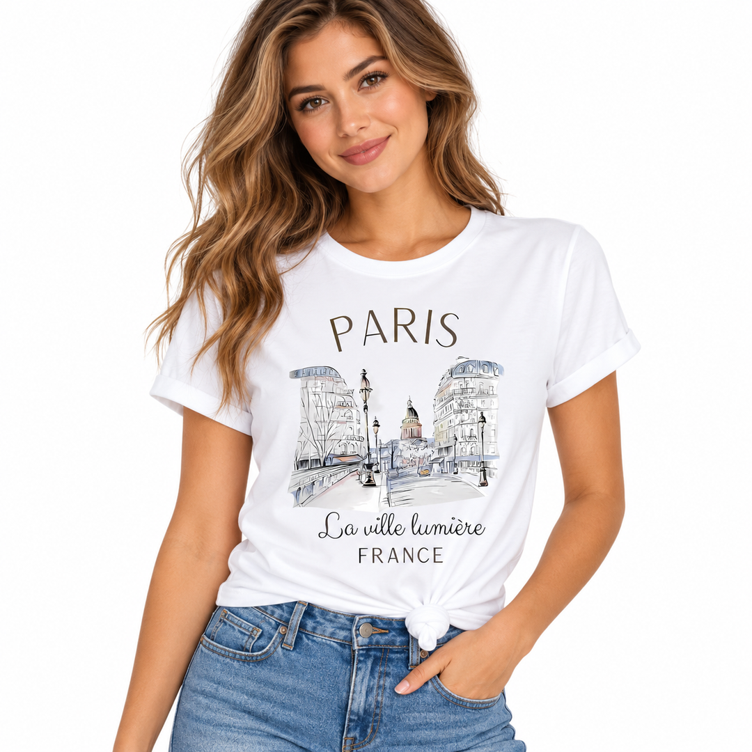 Paris graphic T-shirt for women styled with a front knot, white crew neck tee, Paris city sketch print and blue denim outfit.