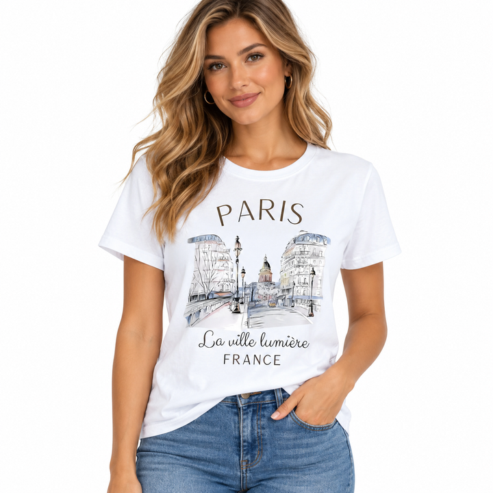Paris graphic T-shirt for women modeled front view with white crew neck tee, city sketch print and casual blue denim styling.