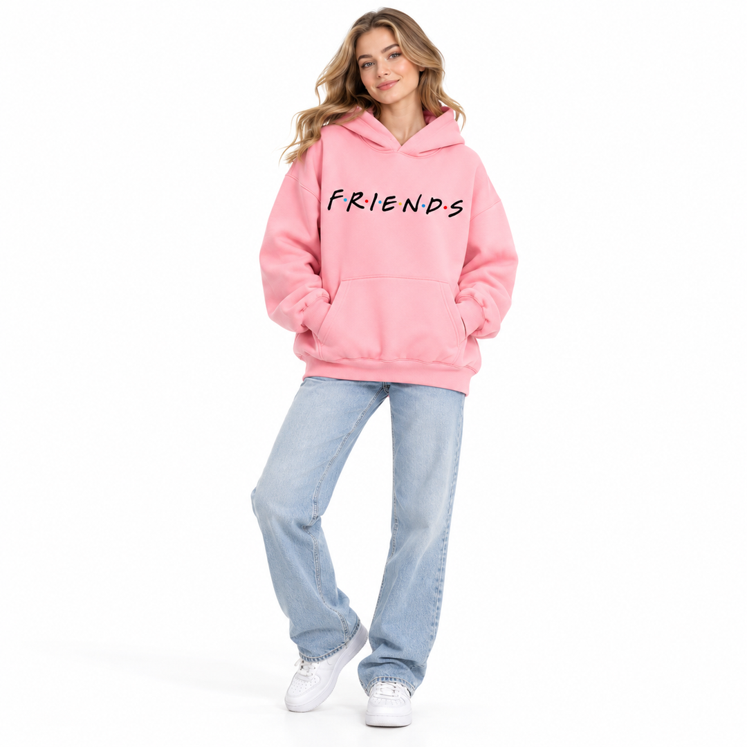 Full-body female model wearing pink letter-print hooded pullover with jeans and white shoes