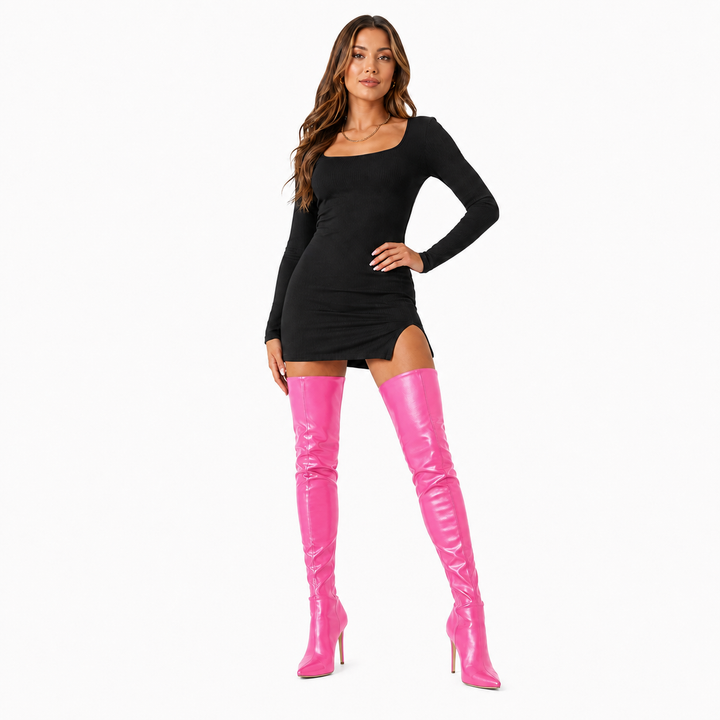 Red over-knee stiletto boots shown on a model with pointed toe and tall shaft visible on white.