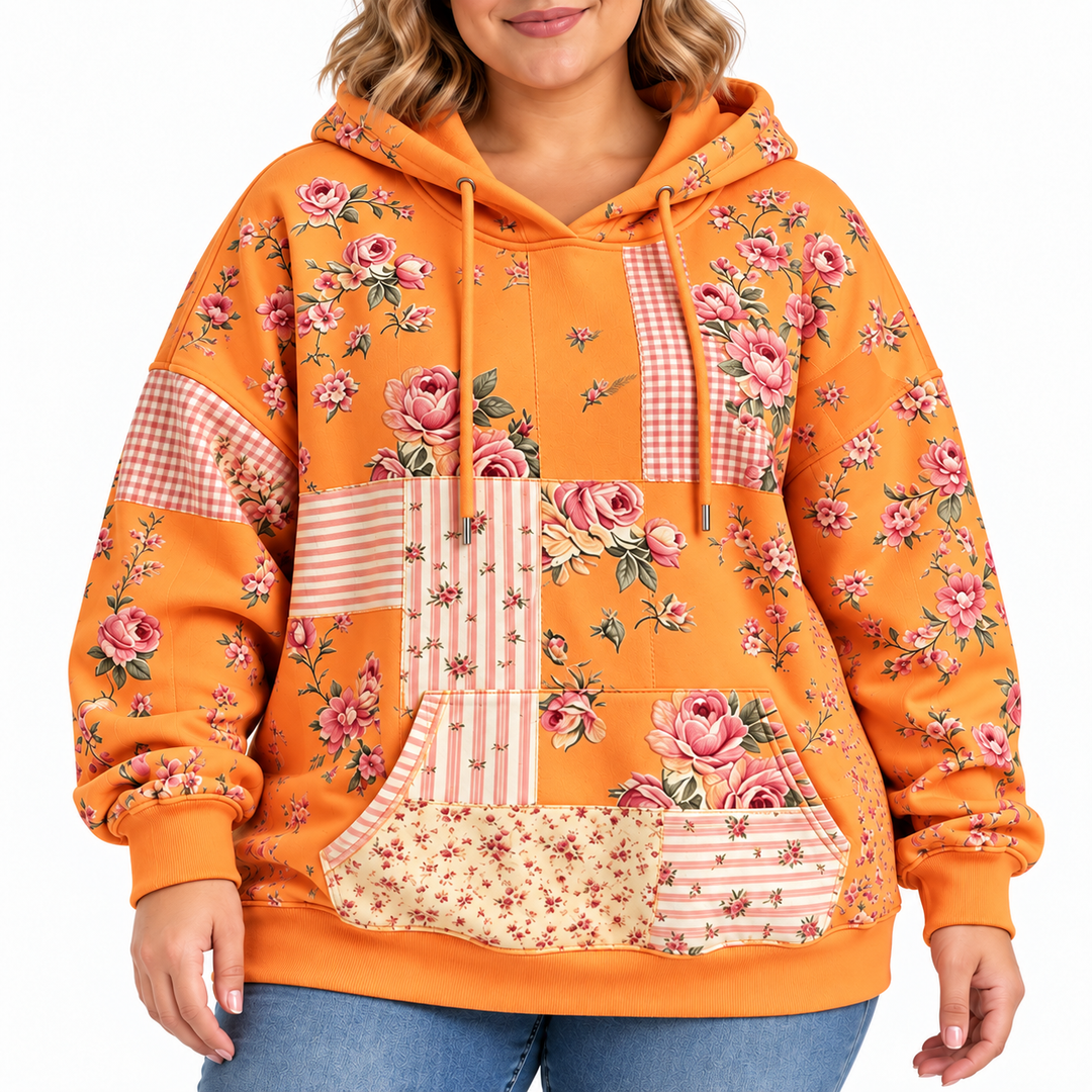 Plus size floral hoodie in tangerine, close-up showing pink rose print, drawstrings, kangaroo pocket and cuffs
