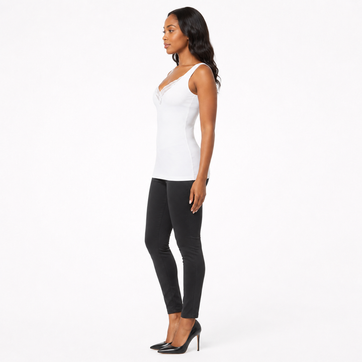 Plus size lace tank top for women in white shown in side view with fitted silhouette and lace V-neck detail