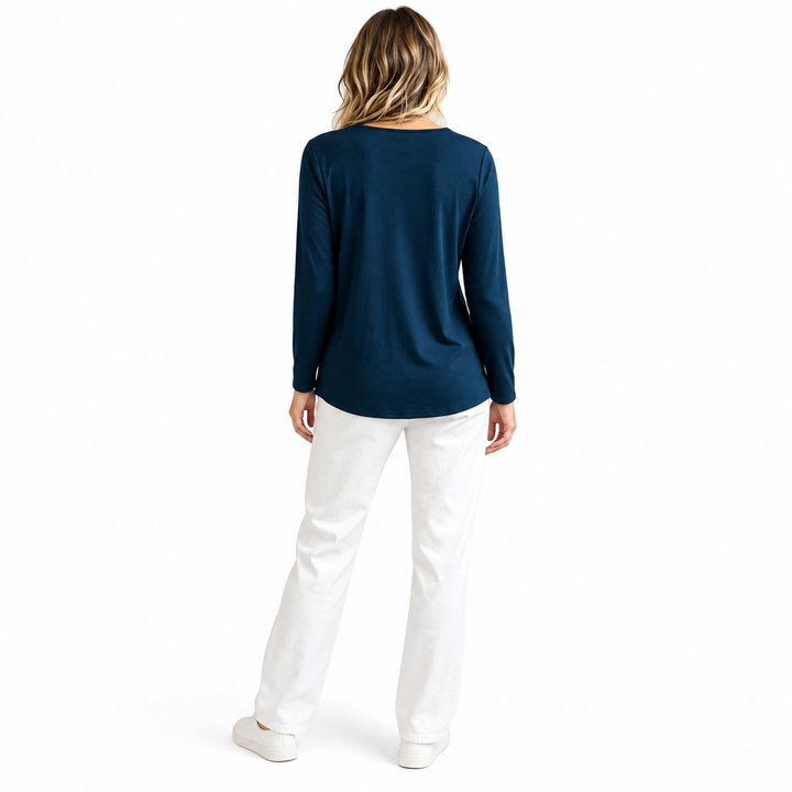 Rear view of the navy top in a standing pose