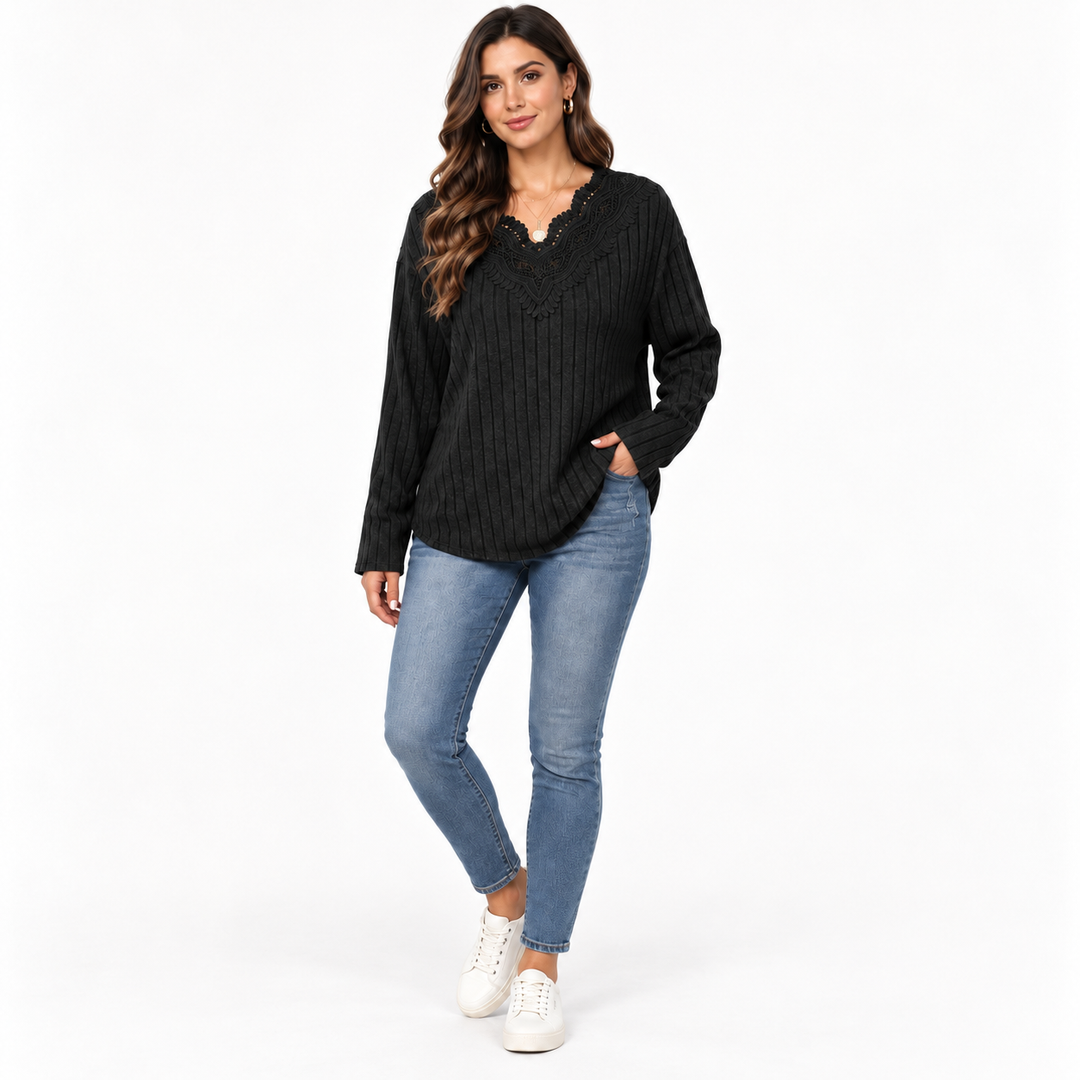 Woman styling black V-neck pullover sweater with denim