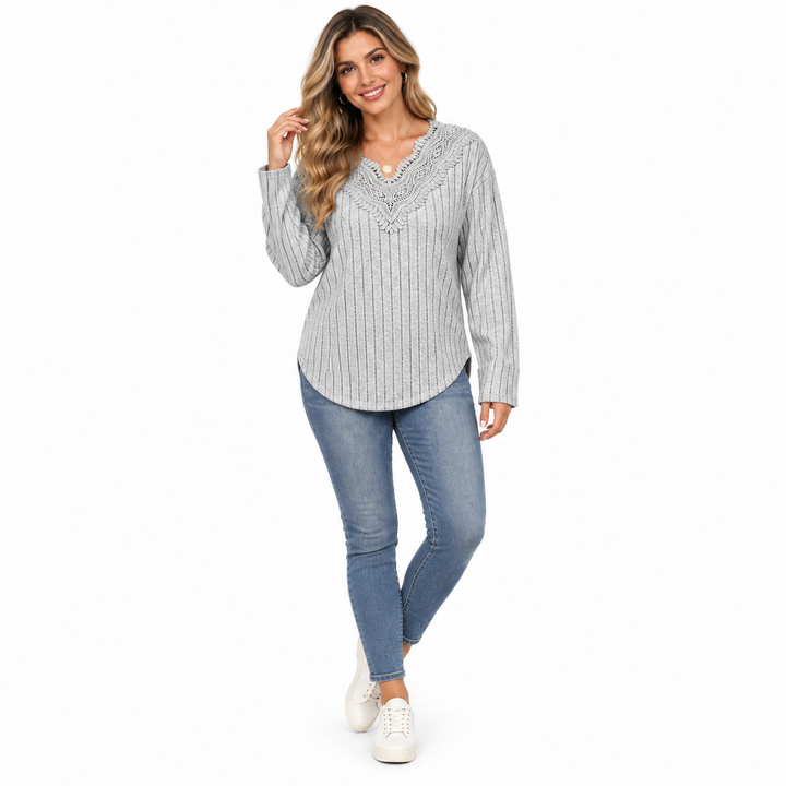 Gray lace V-neck ribbed sweater worn with blue jeans