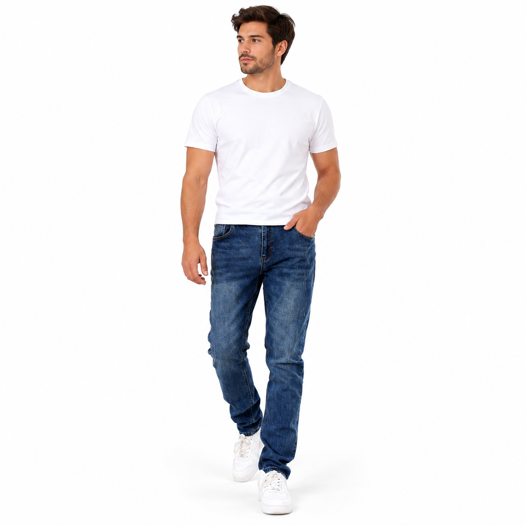 Blue washed jeans styled with a white shirt and sneakers on a walking model