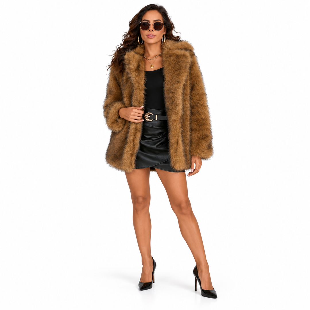 Woman wearing a dark brown faux fur coat with a lapel collar, long sleeves and artificial fur against a plain white backdrop.