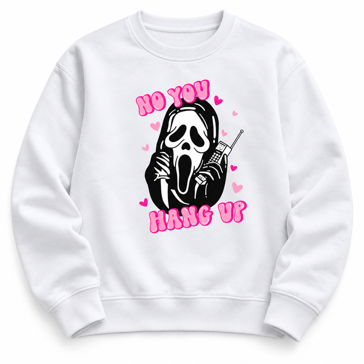 Close view of a white graphic pullover with pink lettering, a black phone graphic and ribbed cuffs in a white studio setting.