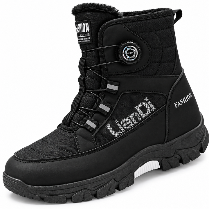 Close view of the black dial-fastened boot with a rotary dial, cable laces and a white sole insert in a white studio setting.